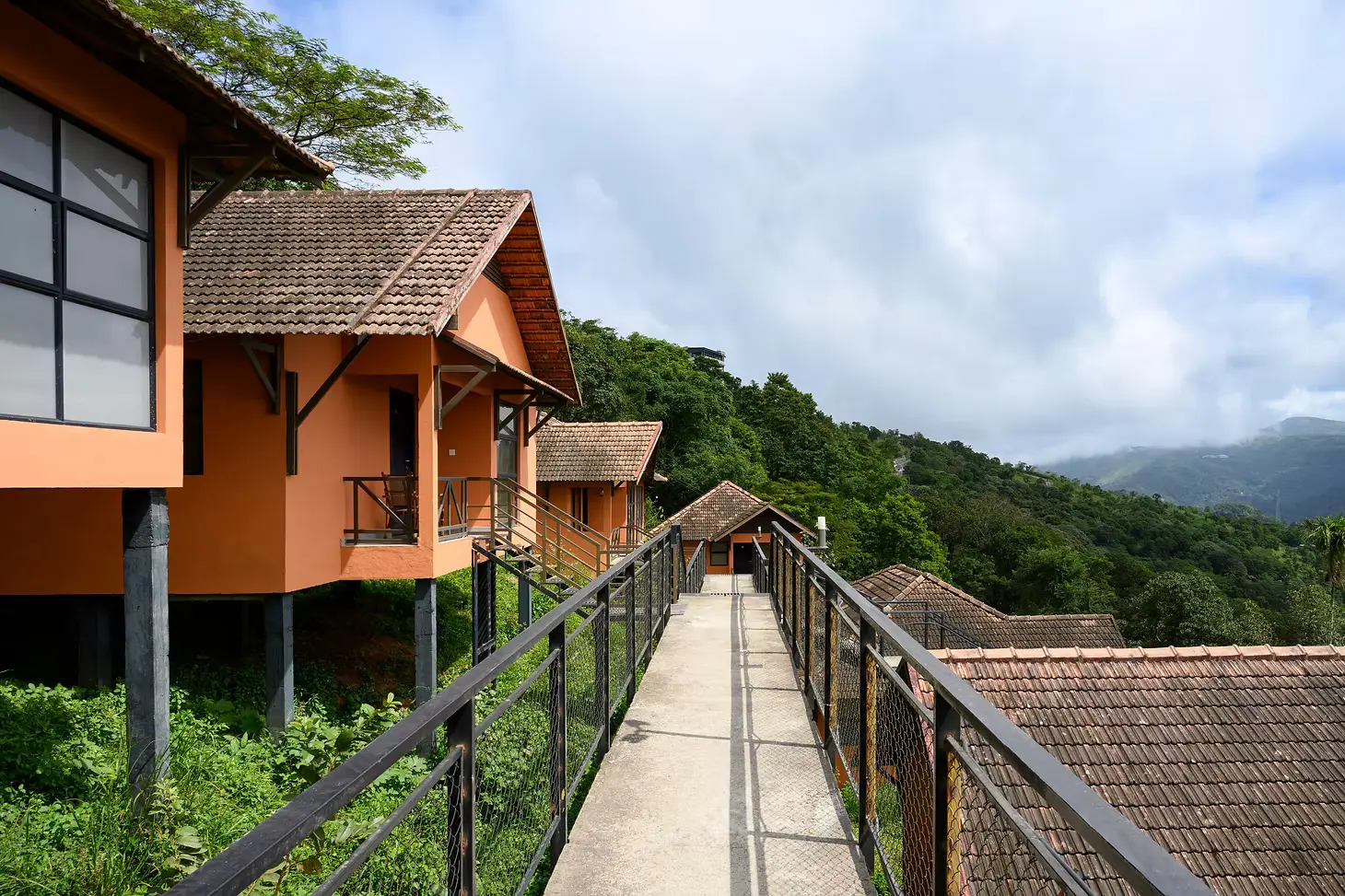Elevated walkway connecting the hillside villas